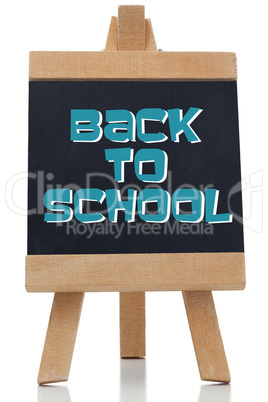 Back to school written in blue on chalkboard