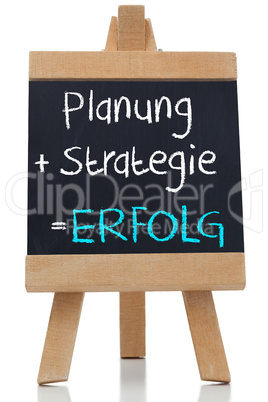 Planning strategy written on blackboard in german