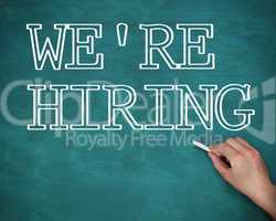 Hand writing we are hiring on green background