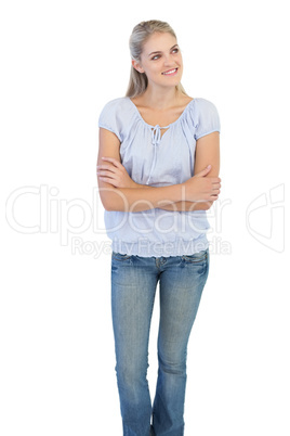 Smiling blonde woman crossing her arms