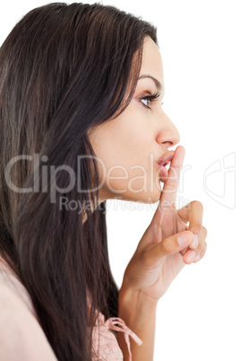 Woman making sign for quiet