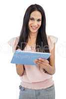 Smiling young woman using tablet pc