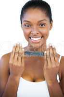 Smiling woman holding nail file