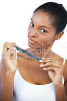 Brunette holding her nail file