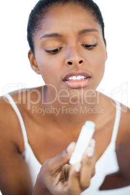 Woman looking at her lip balm