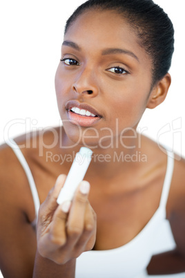 Woman holding her lip balm