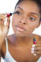 Young woman using mascara for her eyelashes