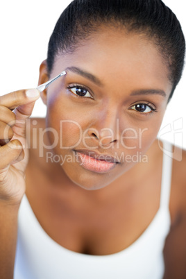 Woman using tweezers