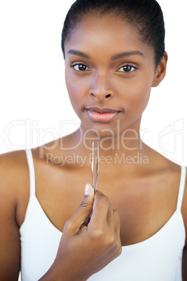 Woman holding her tweezers