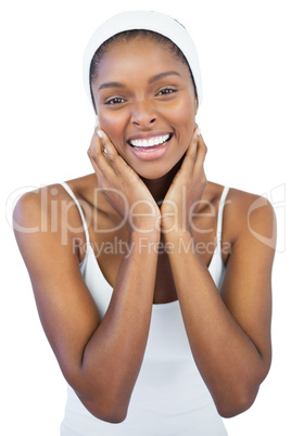 Cheerful woman with headband crossing her arms
