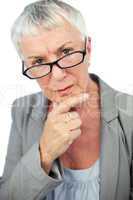 Thinking mature woman wearing glasses