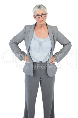 Serious businesswoman with her hands on hips