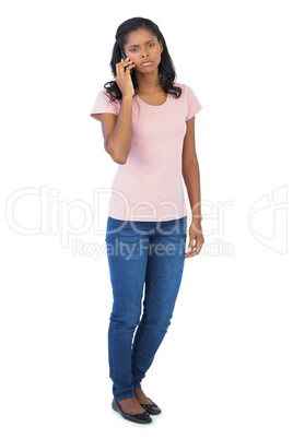 Serious woman calling with her mobile phone