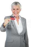 Smiling businesswoman showing her credit card