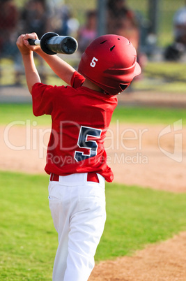 Baseball boy warming up to bat