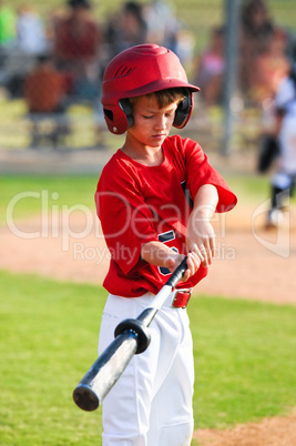 Boy warming up to bat