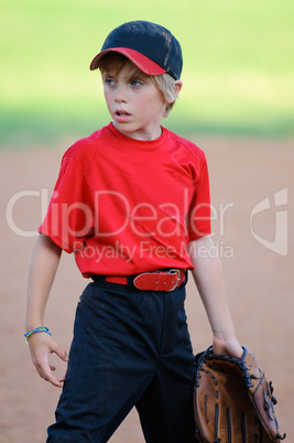 Little league baseball player looking sideways