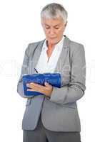 Businesswoman using her clipboard