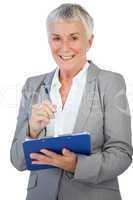 Happy businesswoman using her clipboard