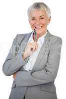 Smiling businesswoman holding pen