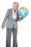 Businesswoman shouting at globe