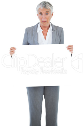 Businesswoman holding blank sign