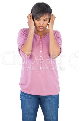 Young woman closing her eyes and listening to music