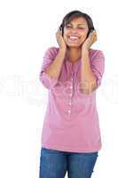 Beautiful woman smiling and listening to music