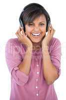 Cute woman enjoying music