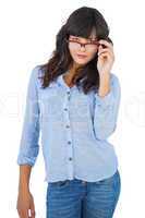 Serious young woman wearing glasses