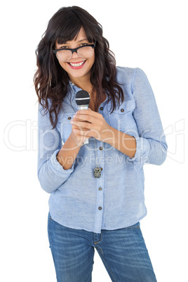 Young woman wearing glasses and singing