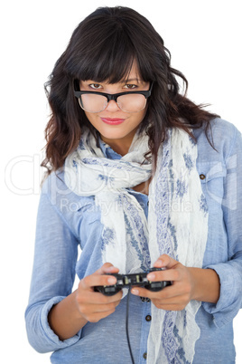 Beautiful woman wearing scarf and glasses playing video games