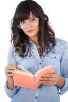Beautiful woman wearing glasses and holding book
