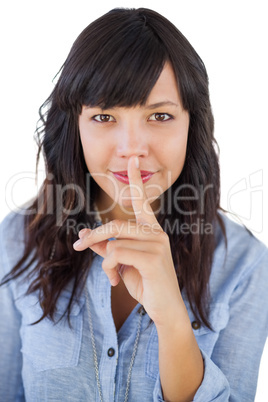 Brunette putting finger on her mouth for silence