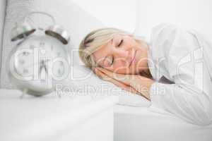 Woman sleeping in bed peacefully