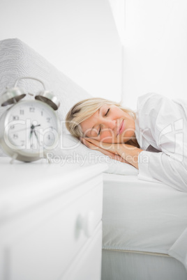 Blonde woman in bed asleep