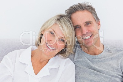 Cheerful couple in bed