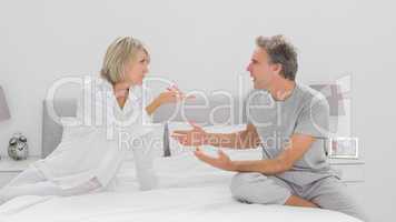 Couple arguing in bedroom