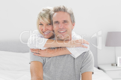 Loving couple smiling at camera