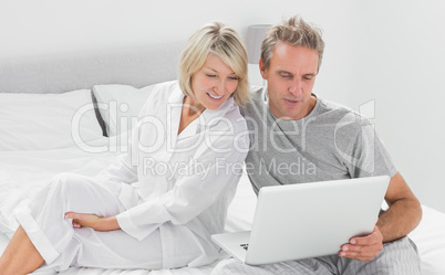 Couple using their laptop