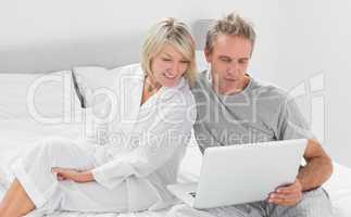 Couple using their laptop