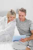 Couple using their tablet pc