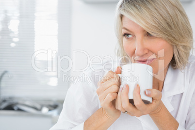 Content woman having coffee in the morning