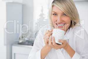 Happy woman having coffee in the morning