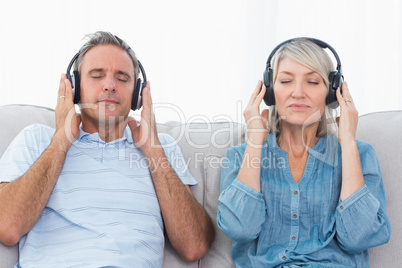 Couple listening to music on the couch