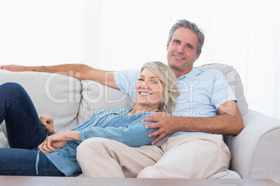 Happy couple relaxing at home