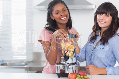 Happy friends about to make healthy juice