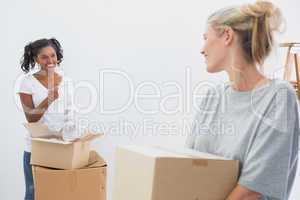 Cheerful young housemates moving into new home