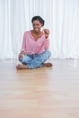 Cheerful young woman showing her new house keys