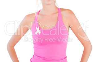 Woman wearing pink tank top and breast cancer ribbon